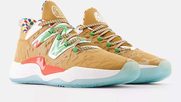 View of brown and green New Balance shoe.